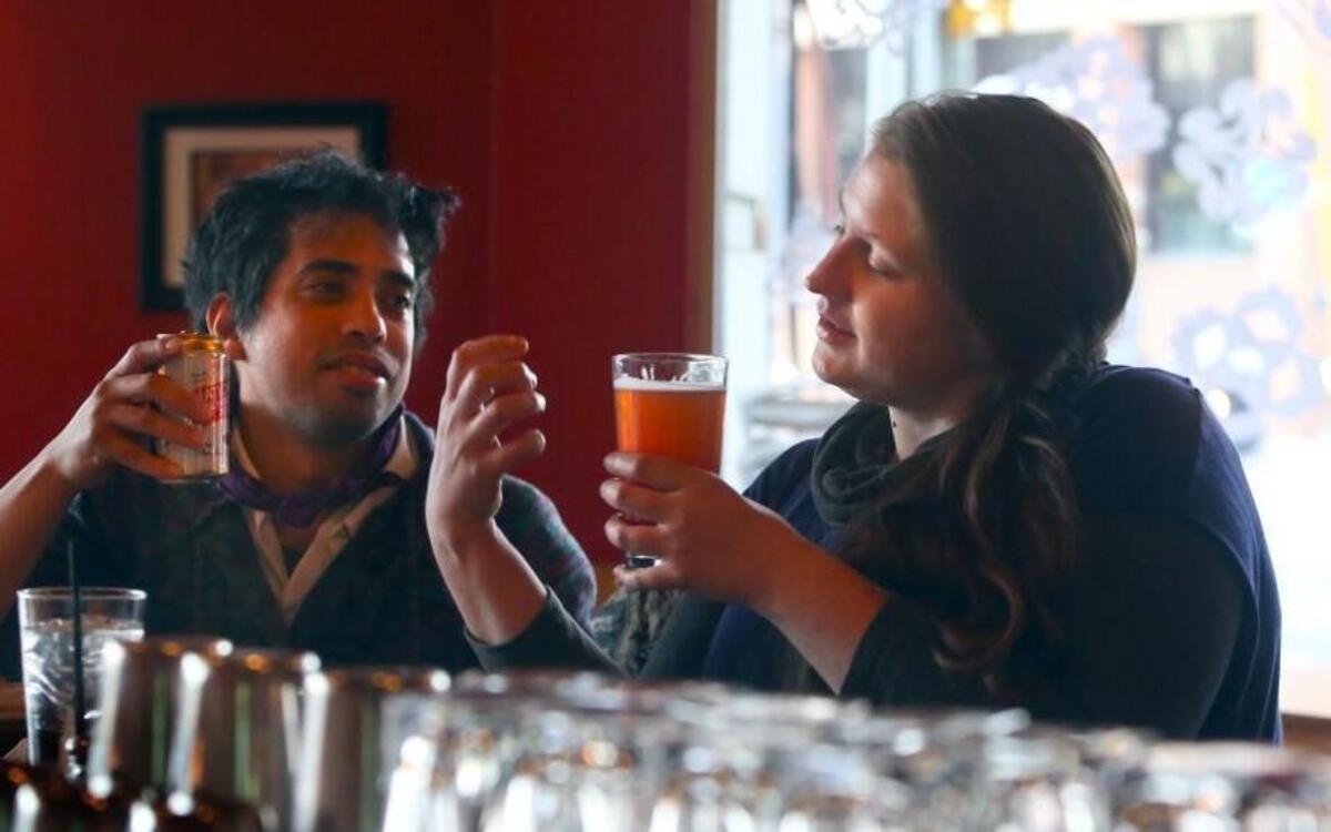 Regulars Joel Langholtz and Kate Carey, both of Raleigh, hang out to eat and drink at The Borough in downtown Raleigh, N.C. on Wednesday, January 13, 2016.
