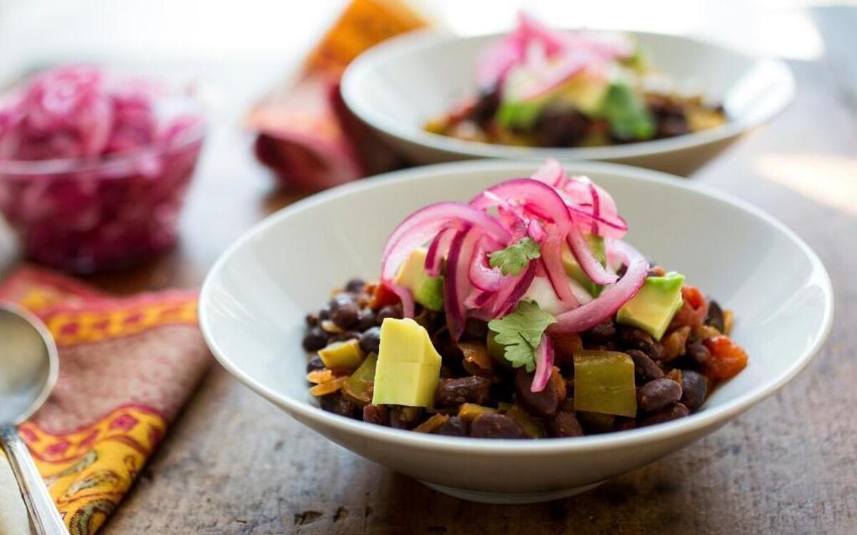 Bean skillet chili, made with your choice of canned beans and served with pickled onions that you make yourself using lime juice and sugar. Everyone should have several meals they can whip up on autopilot, leaving your mind or attention free for other priorities.
