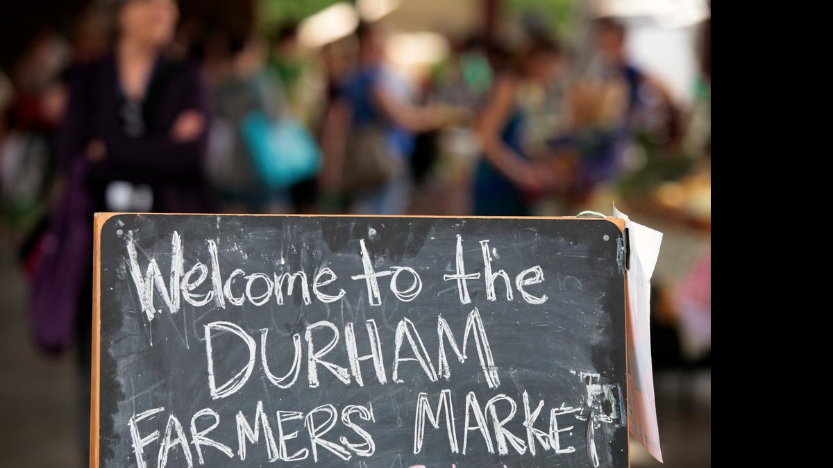 
A guide to farmers markets in Wake, Chatham, Durham, Franklin, Johnston, Lee Orange and Vance counties. The welcome sign was out in May 2014 at the Durham Farmer's Market on Foster Street in Durham, NC. 
