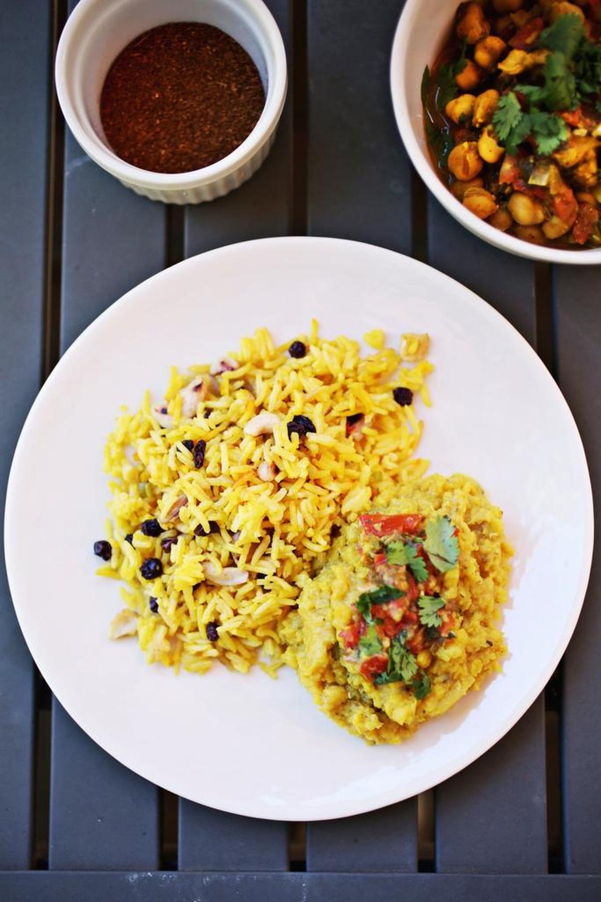 Basmati Rice Pilaf with Raisins and Cashews, Red Lentil Dal with Spice Infused Ghee and Chana Masala.