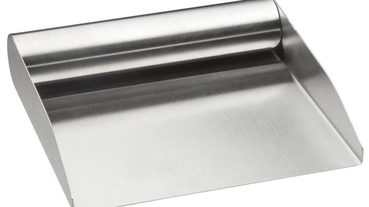 You have to search to find one (Amazon carries them), but a bench scraper with sides makes it easy to move ingredients quickly.