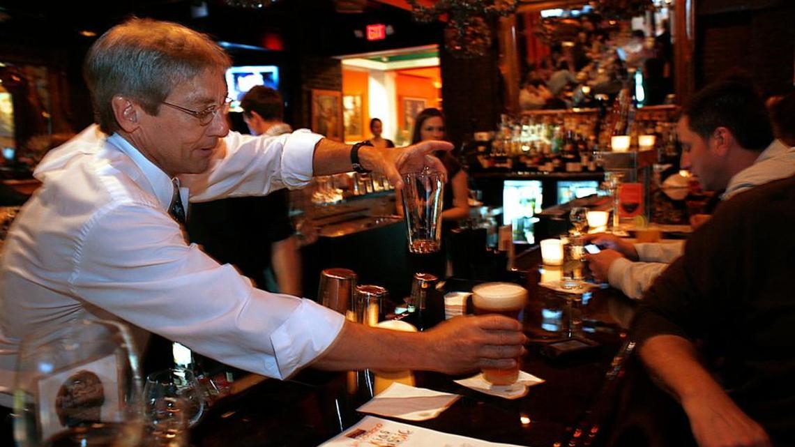 Cary Mayor Harold Weinbrecht worked a shift as a celebrity bartender in 2010 for a charity event at Giorgio, a restaurant on Cary Parkway. If the “brunch bill” passes, local city and county officials would be able to vote on whether to allow restaurants to serve alcohol before noon on Sundays. News & Observer file photo.