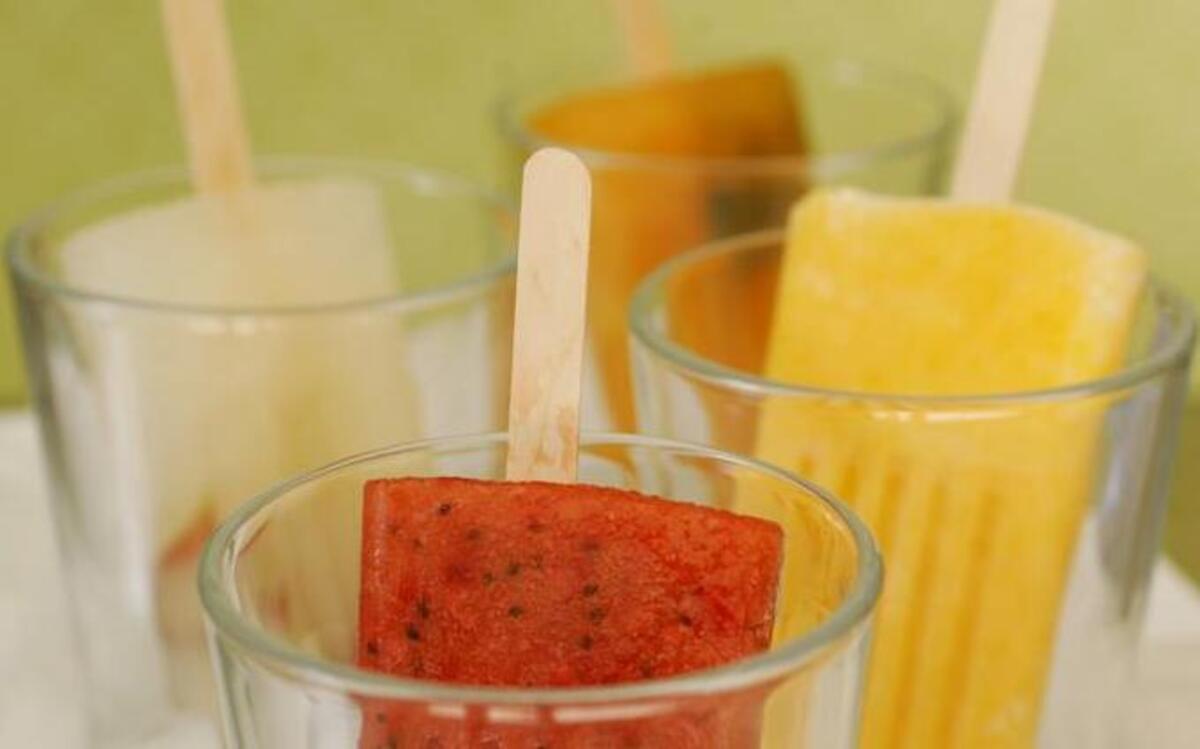 
Strawberry kiwi, front, grape, left, mango lassi, right, and Southern sweet tea, back, are some creative recipes for homemade popsicles.
