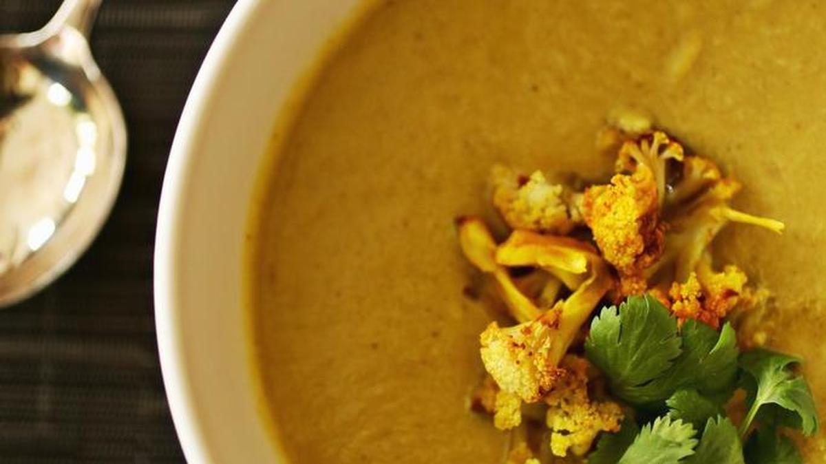 Turmeric, cumin and coconut milk are added for an Indian flair in this Cauliflower Soup with Coconut and Turmeric.