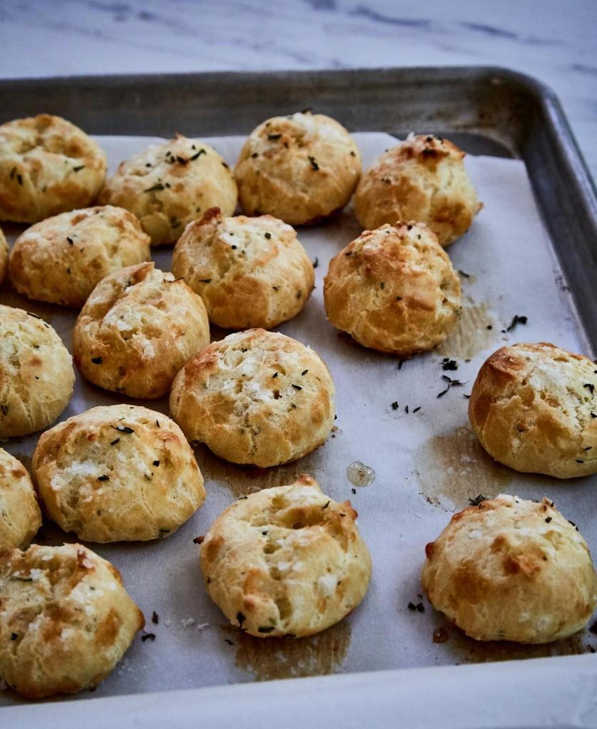 The airy cheese puffs known as gougères make fantastic hors d’oeuvres. These Garlic and Herb Gougeres are from “Le Creuset: A Collection of Recipes from Our French Table.”