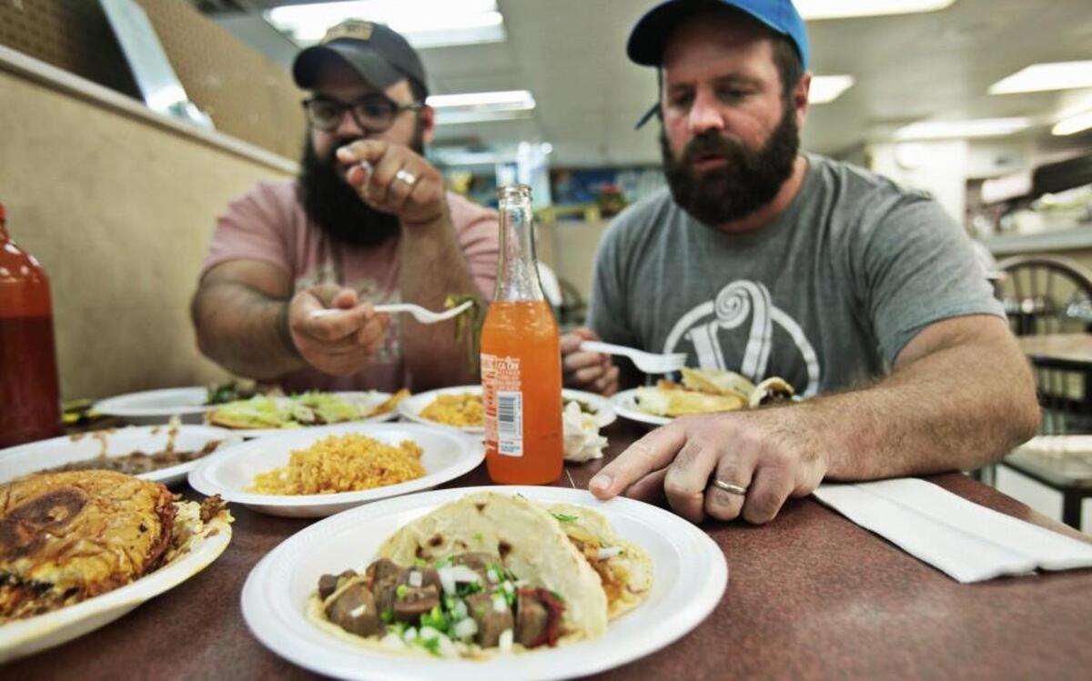 
From left, Andrew Ullom and Sam Ratto share an expansive lunch at La Cabana Taqueria on Capital Blvd. in Raleigh on June 29, 2015. Ullom and Ratto’s quest is to find the best taco.
