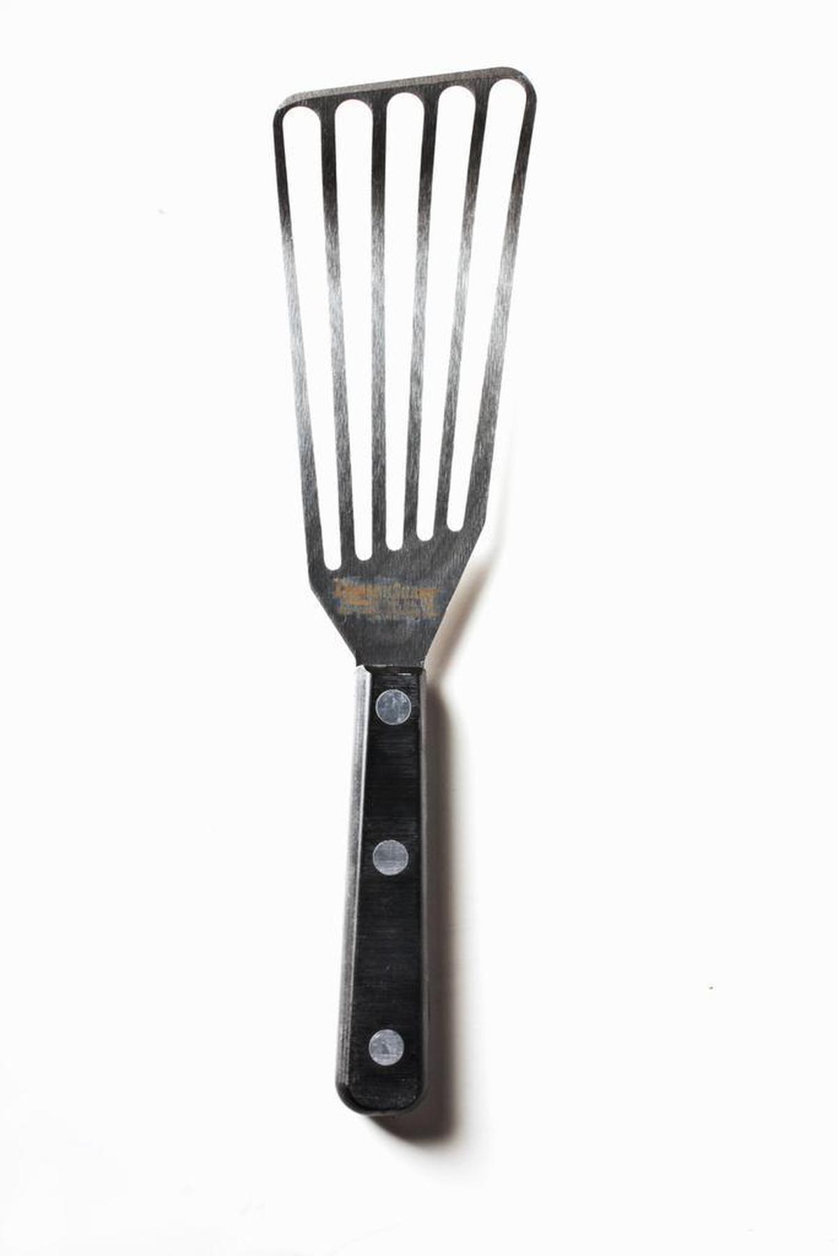 A Slotted Chef's Fish Spatula can be purchased at most kitchen stores.