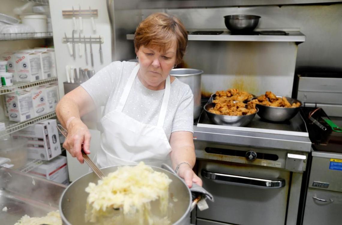 Owner Judy Page cooks cabbage at Seaboard Station Restaurant in Hamlet, N.C., Thursday, June 22, 2017.