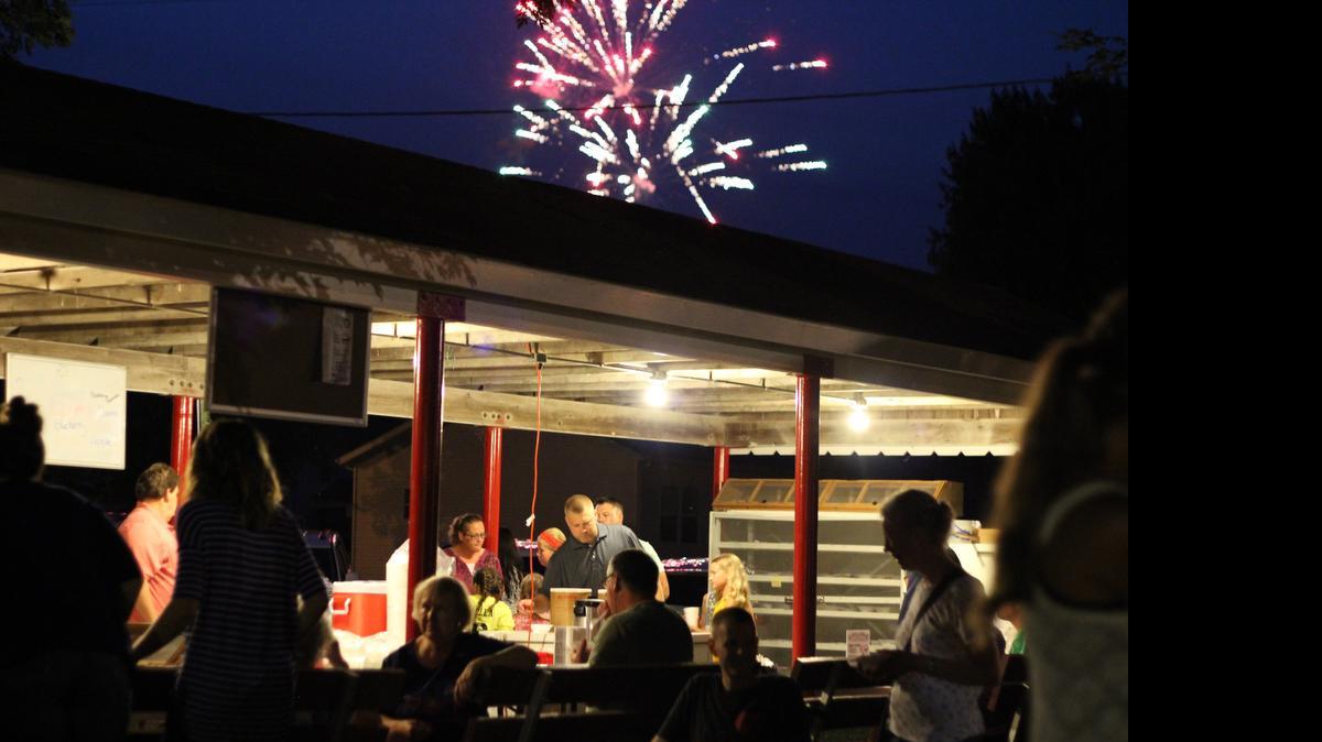 
Fireworks over the Santa Fe Ball Association pie and ice cream stand at the annual July 4th picnic in Alma, Mo.
