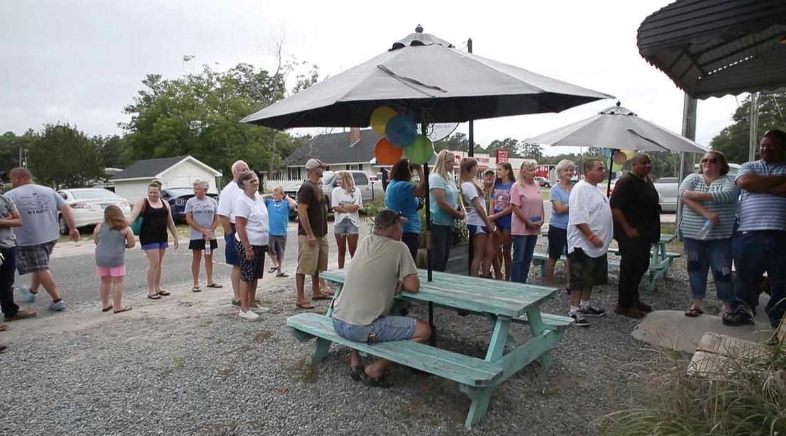 Folks wait in line for the opening of Southern Smoke BBQ in Garland on Friday, June 30. The take-out only restaurant is open on Thursdays and Fridays at 11:30 a.m. Some people line up an hour before opening to ensure they can partake in wood smoked meats, fried chicken and side dishes created by chef Matthew Register.
