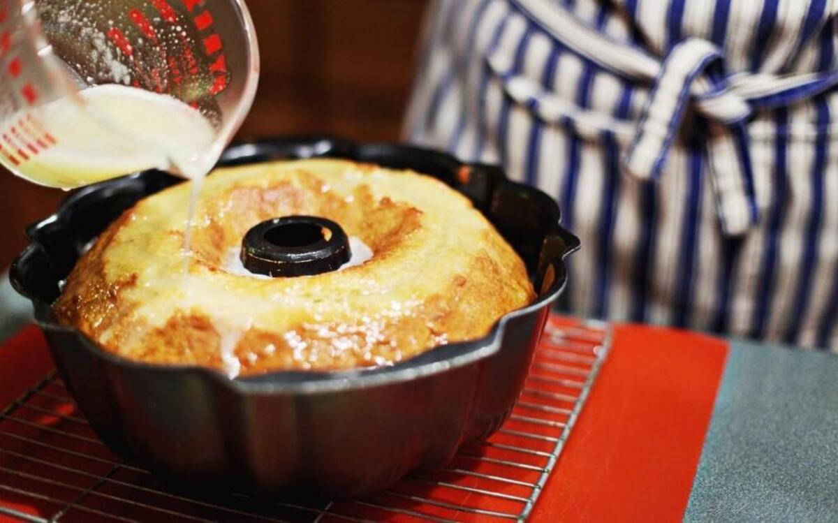 Becky Ogburn spreads icing over Eggnog Rum Cake in her Raleigh home Monday morning, Nov. 30, 2015. Ogburn uses her mother's recipe to make more than 50 cakes for the holidays.