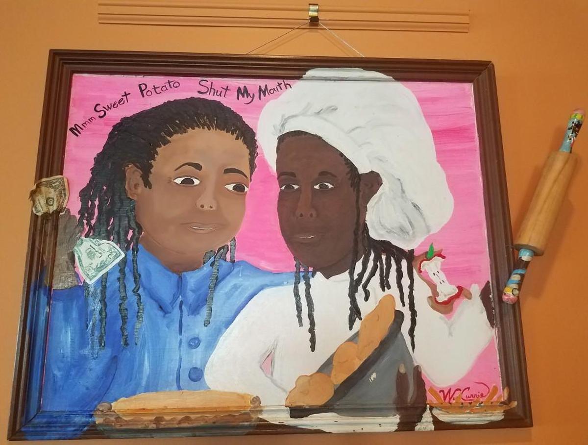 Vivián Joiner and Stephanie Tyson are painted in portrait that was given to them when their restaurant Sweet Potatoes first opened in 2003. The portrait helped inspire the restaurant’s name: Sweet Potatoes (Well Shut My Mouth!!) and moved to the new location that opened in summer 2017.