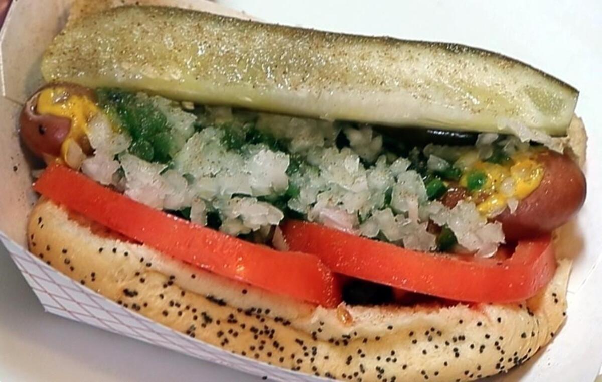 Mike’s Chicago Dog (and more) in Asheboro, NC, offers authentic Chicago-style hot dogs. Here is one made by owner Mike Jones at the restaurant on May 18, 2017. It consists of: A steamed poppy-seed bun and a steamed premium Vienna Beef hot dog (from Chicago) with (order of ingredients is important) - yellow mustard, neon green sweet relish, chopped sweet onion, a couple of tomato wedges, a couple of sport peppers (fairly hot), a dill pickle wedge and a sprinkle of celery salt.