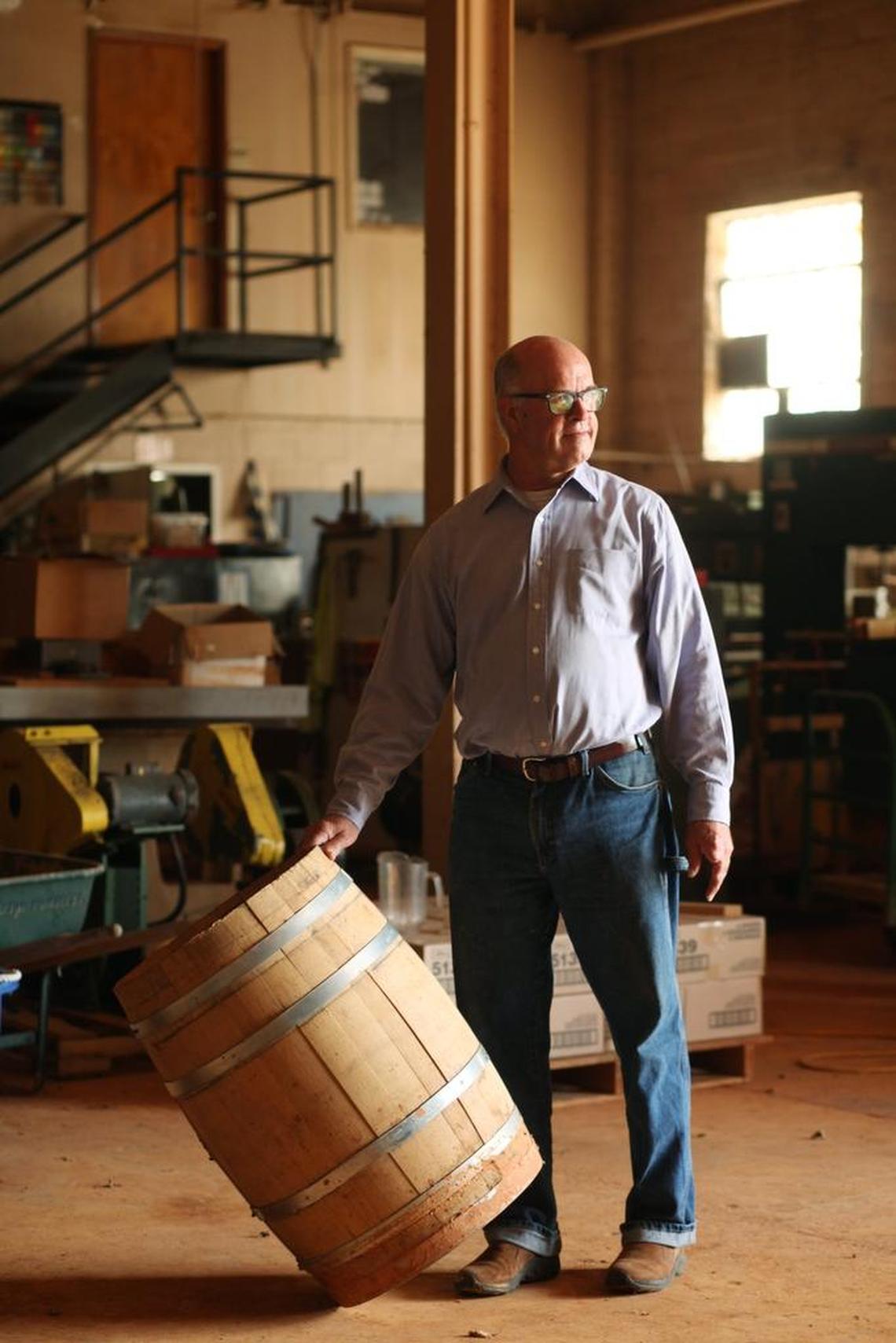 Boylan Bridge Brewpub founder Andrew Leager stands in the 8,000-square-foot woodworking shop in the basement below on Thursday, June 16, 2016, where he plans to bring in two new businesses: a distillery and a barrel-making operation.