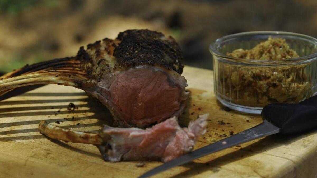 This Simple Grilled Rack of Lamb is flavored with pepper and rosemary and is then cooked on a grill.