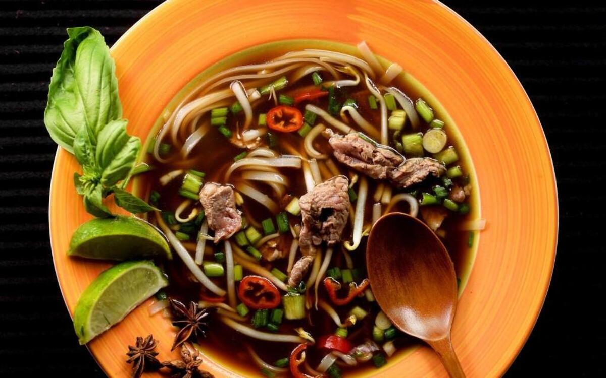 A quick version of Beef Pho is easy to put together because the steak cooks in minutes.
