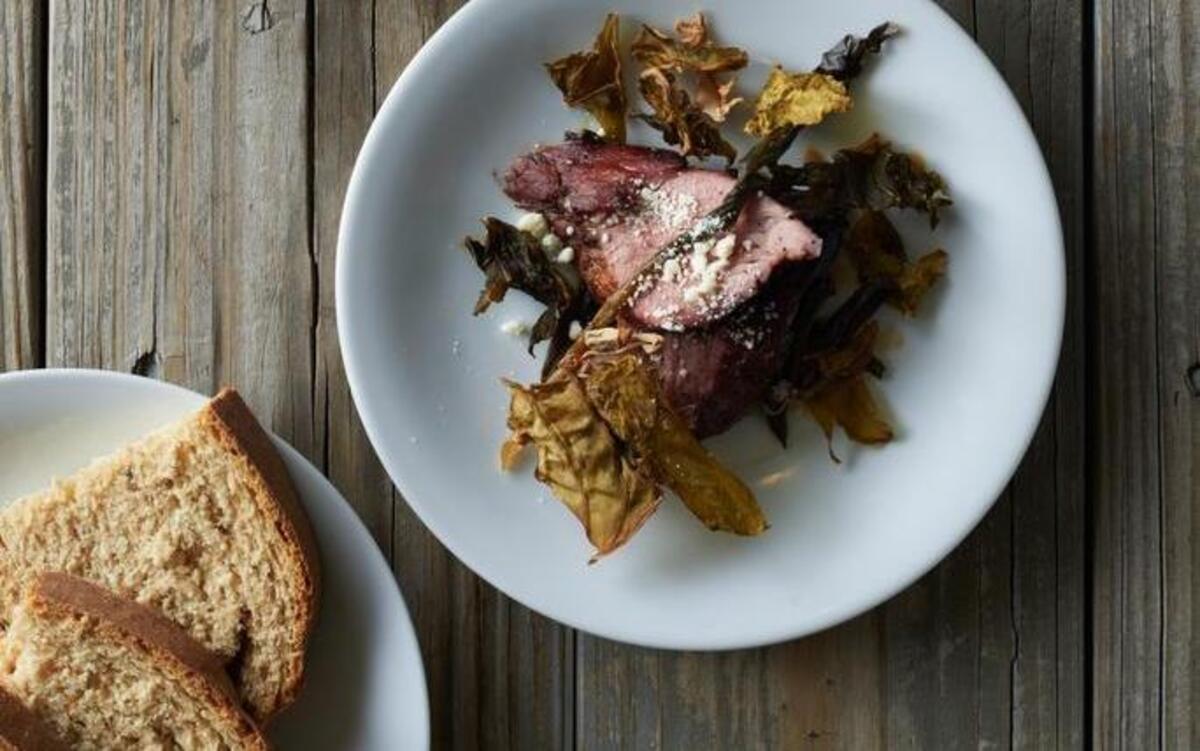 From top: hominy porridge with creasy greens and fatback by Asheville, N.C., chef Matt Dawes; Elliott Moss' smoked and cured pork tenderloin with leather britches and pickled ramps; sorghum bread.
