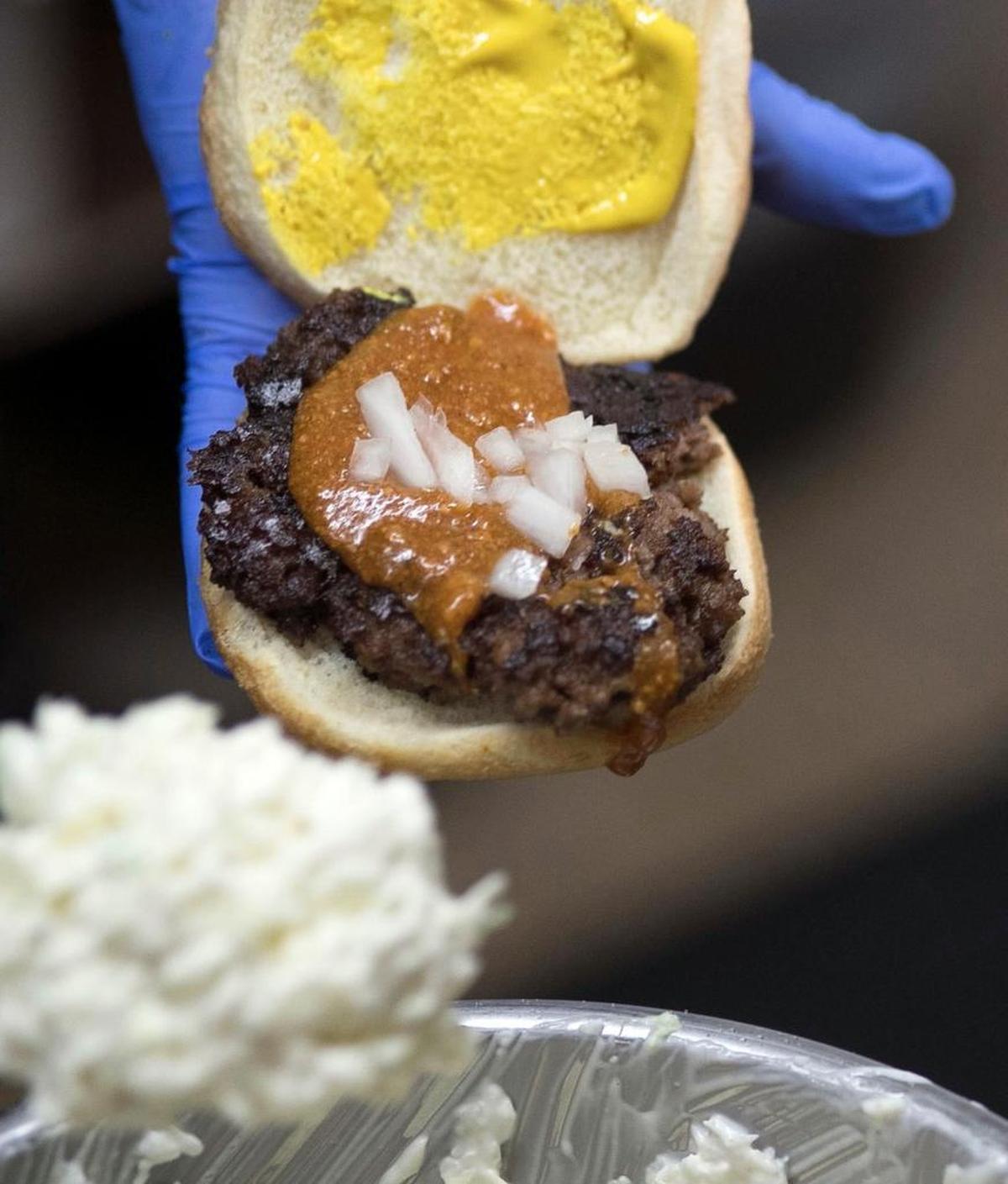 The classic Melvins’ hamburger, being prepared all the way.