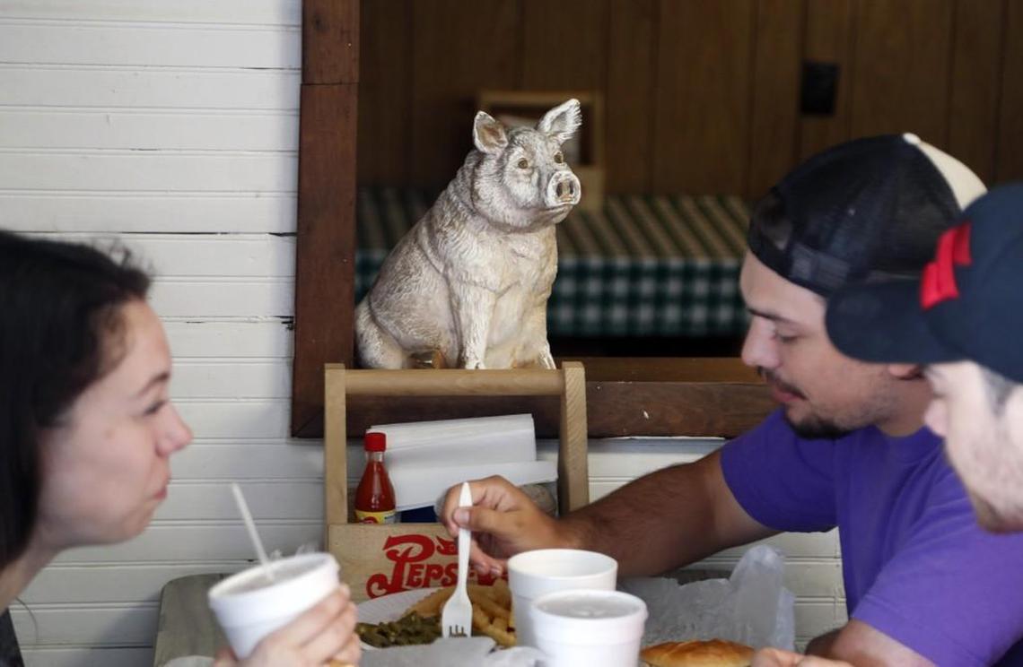 Pig figurines decorate the room while diners eat at B's Barbecue in Greenville NC, on June 7, 2017. B's is an old-time barbecue restaurant that ranks near the best in the state in several surveys.