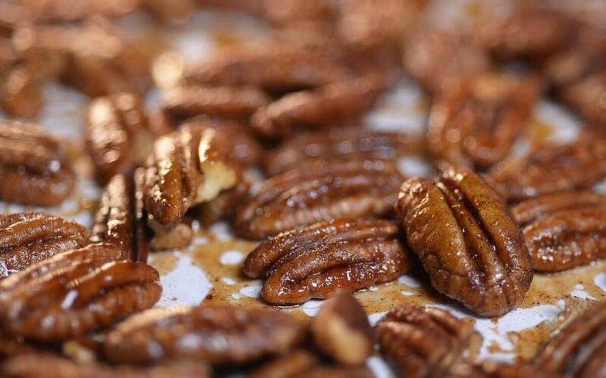 Pecans tossed with maple syrup and pumpkin pie spice.
