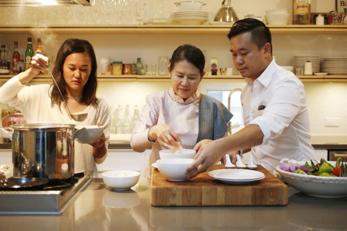 Vanvisa Nolintha, left, serves breakfast with her mother, Bida, center, and brother, Vansana, right in 2016. The brother and sister own the Laotian restaurant, Bida Manda, and are opening Brewery Bhavana with brewer Patrick Woodson.