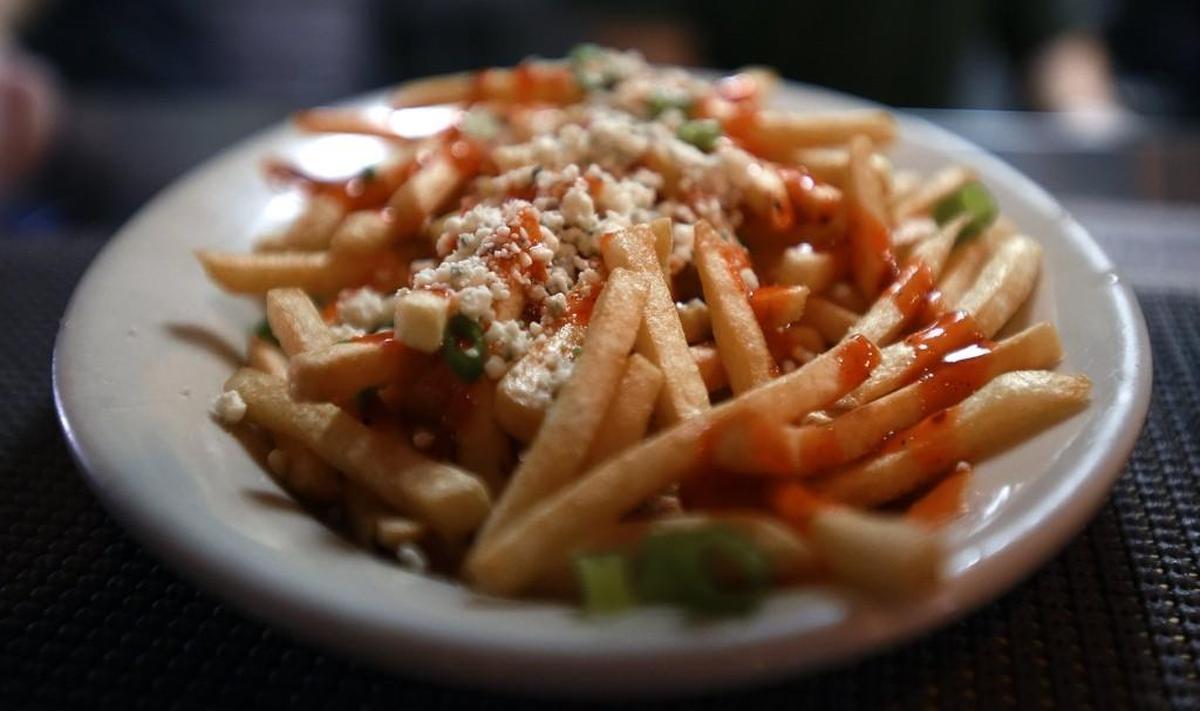 An order of Buffalo fries awaits delivery to a table during lunch at the Pass the Salt Cafe in Currituck, N.C., Saturday, Aug. 5, 2017.