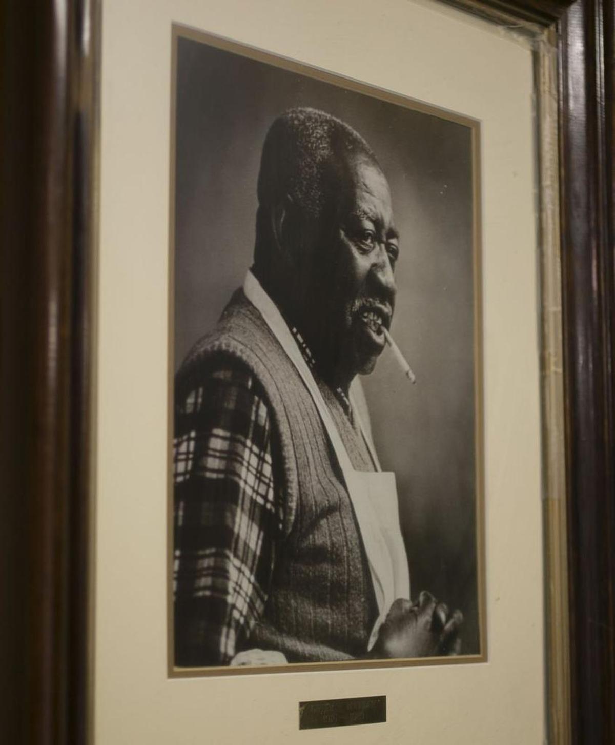 A portrait of B.W. Keaton, who founded Keaton’s Barbecue restaurant in 1953, hangs inside the restaurant on Thursday, July 6, 2017 in Cleveland, N.C.