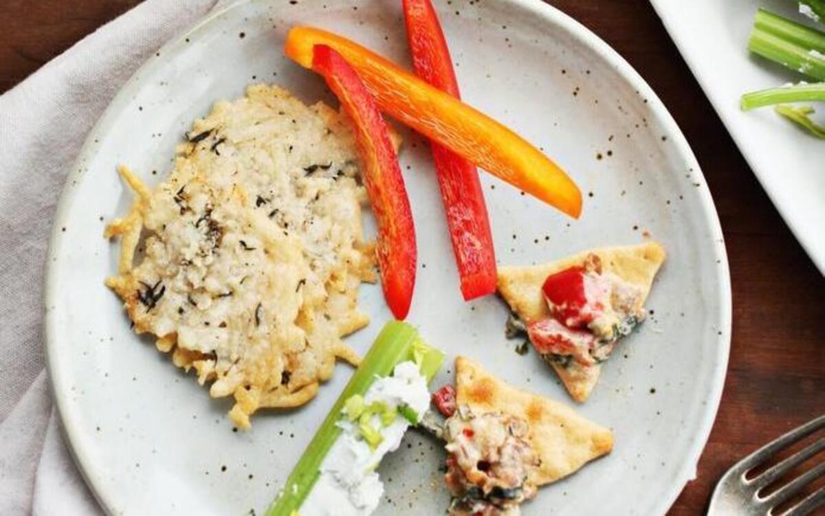 Throw a great holiday party with Citrus Spritzer, Parmesan Crisps, Celery Stalks stuffed with Blue Cheese and Apples, and Sausage Bean and Spinach Dip served with pita chips and fresh bell peppers.