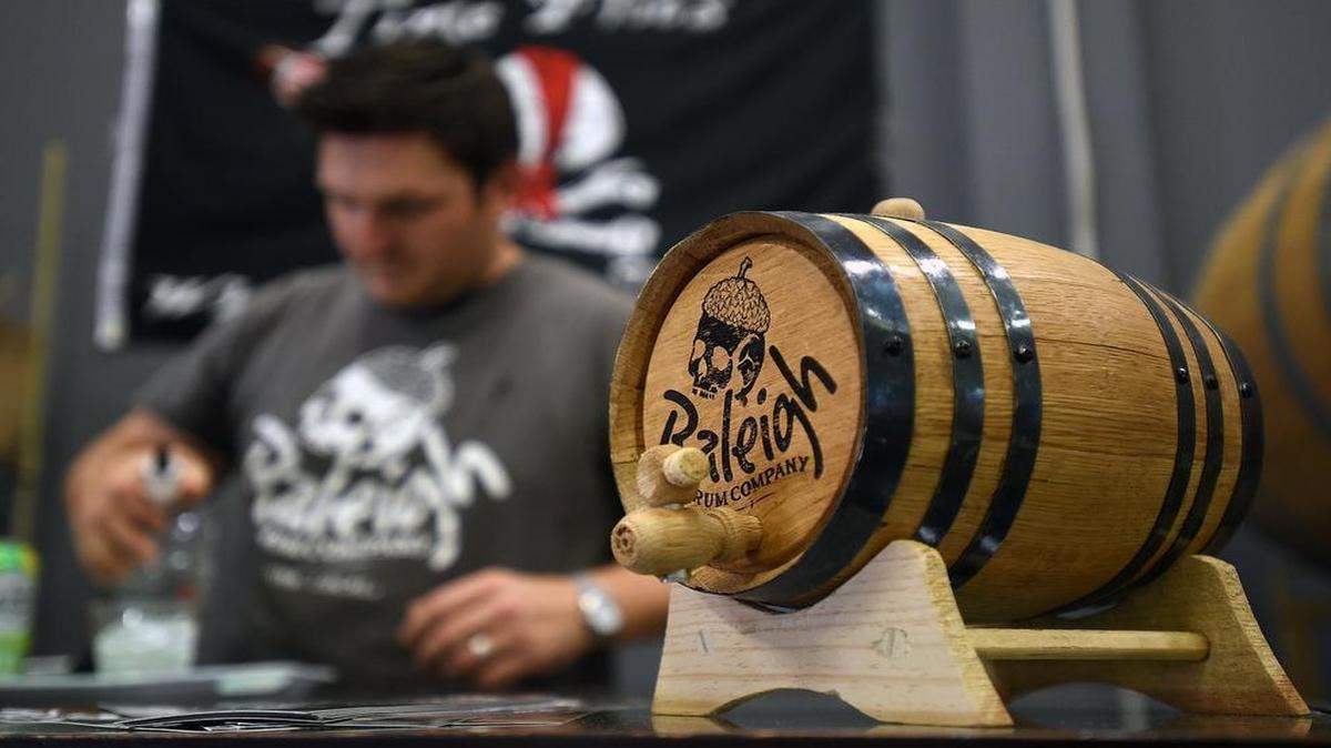 
John Benefiel makes a rum drink during a taste testing at the Raleigh Rum Company's distillery in northeast Raleigh, Saturday, June 20, 2015.
