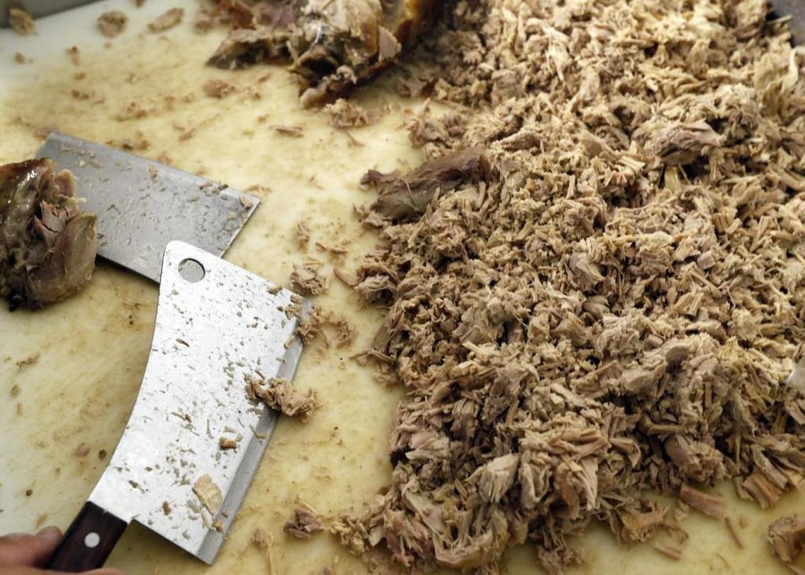 Nicholas Godley has the pork chopped up and ready to be served at B's Barbecue in Greenville NC, on June 7, 2017. B's is an old-time barbecue restaurant that ranks near the best in the state in several surveys.