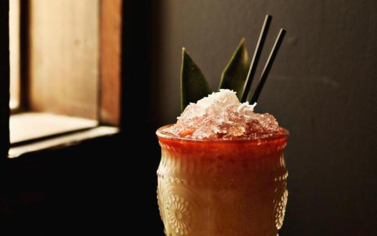 Aikane's Hula House from Gallo Pelón Mezcaleria is made up of Wahaka Joven Mezcal, Lemon Hart 151, Grilled Pineapple Juice, Coconut Cream, House Orgeat, and Angostura Bitters. We think it gets “Best Overall Bar” for its well-crafted cocktails, hip atmosphere, cozy patio, knowledgeable bar staff, and some of the best food in town.