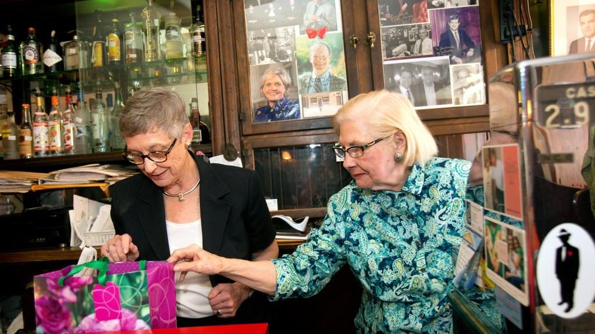 Floye Dombalis, right, pictured in 2014, is part of the family that owns the Mecca restaurant in downtown Raleigh. She is photographed with then-N.C. State Chief Supreme Court Justice Sarah Parker.
