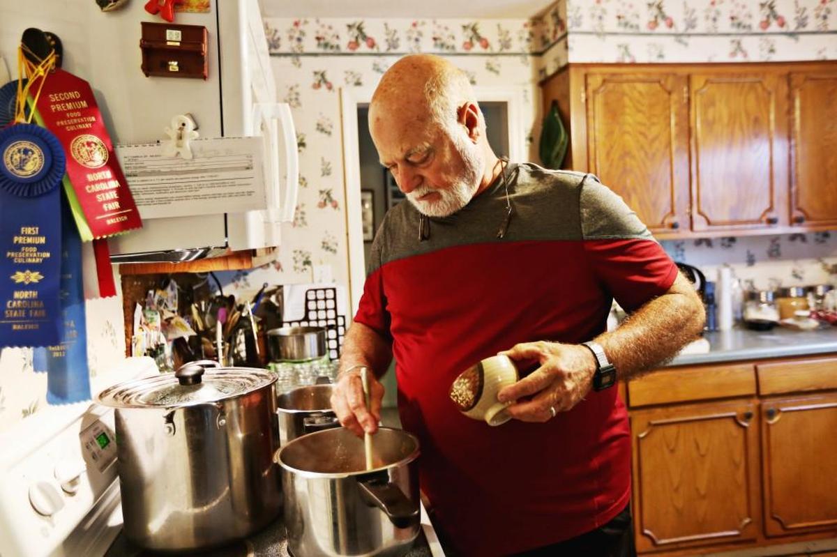 Mike Richardson makes his ribbon-winning pepper jelly at his Raleigh home in October. Richardson has won several ribbons over the years from the N.C. State Fair for his jellies and preserves. He makes several recipes annually to give away to friends for the holidays.