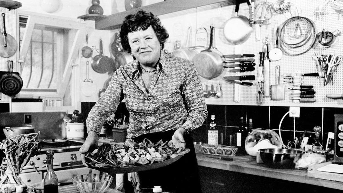 American television chef Julia Child shows a salade nicoise she prepared in the kitchen of her vacation home in Grasse, southern France, in this Aug. 21, 1978, file photo. Julia Child, who brought the intricacies of French cuisine to Americans through her television series and books. It should come as little surprise that fans across the country celebrated Julia Child’s 105th birthday on Aug. 15.