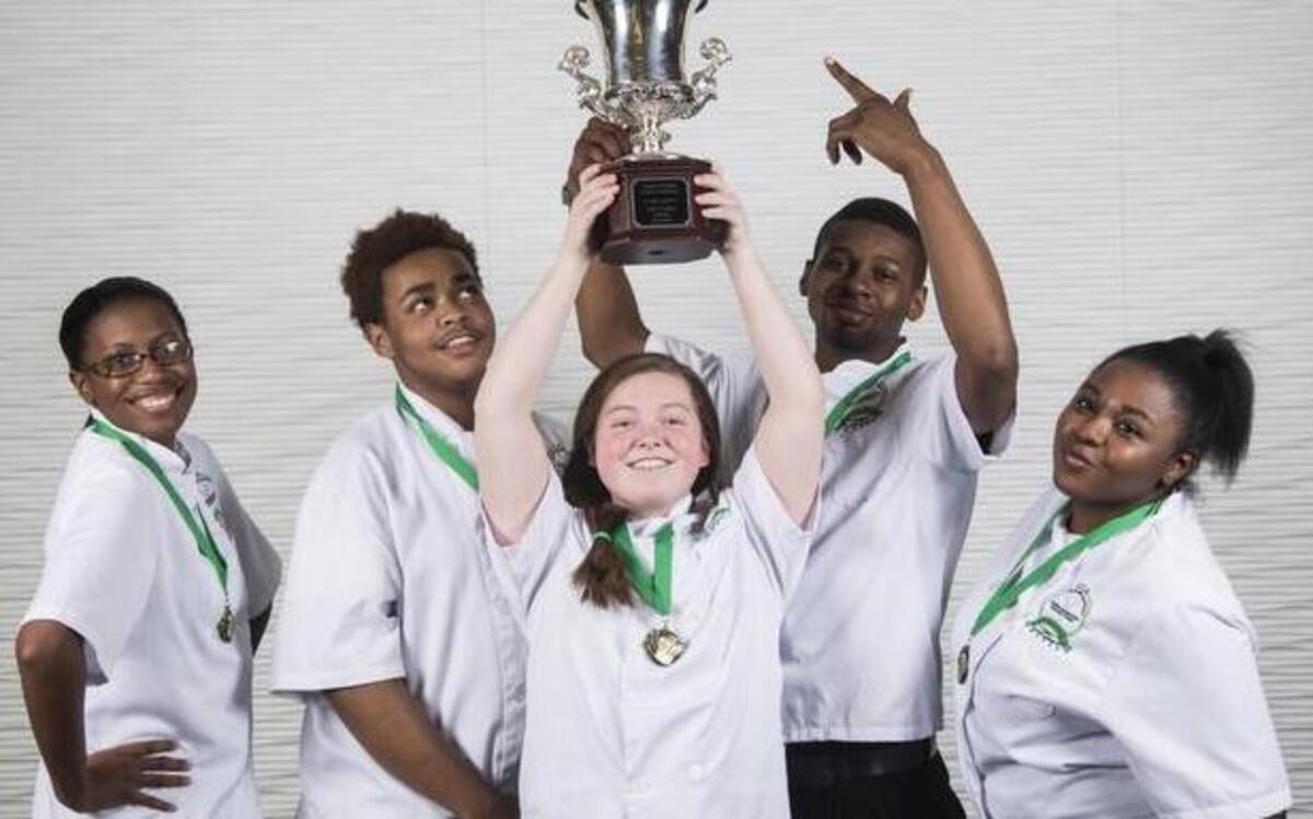 
Cary High’s culinary team of Tatyanna Stewart, Miles Austin, Sheridan Lovell, Jarad Gilbert and Parkari Boykin show off the trophy they earned by winning the culinary competition at the North Carolina ProStart Invitational on March 24.
