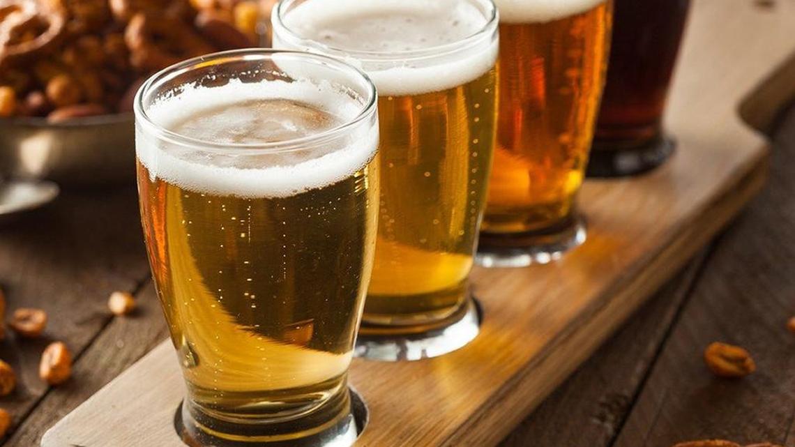 Assorted beers in a flight ready for tasting.