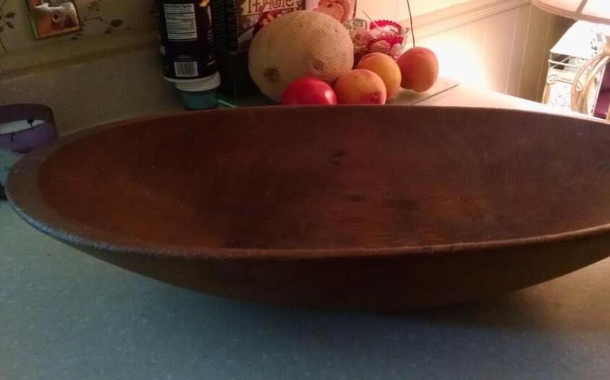 Mary Lou Rhodes of Fuquay-Varina cherishes a bread tray made for her mother as a wedding present by her father in 1921.