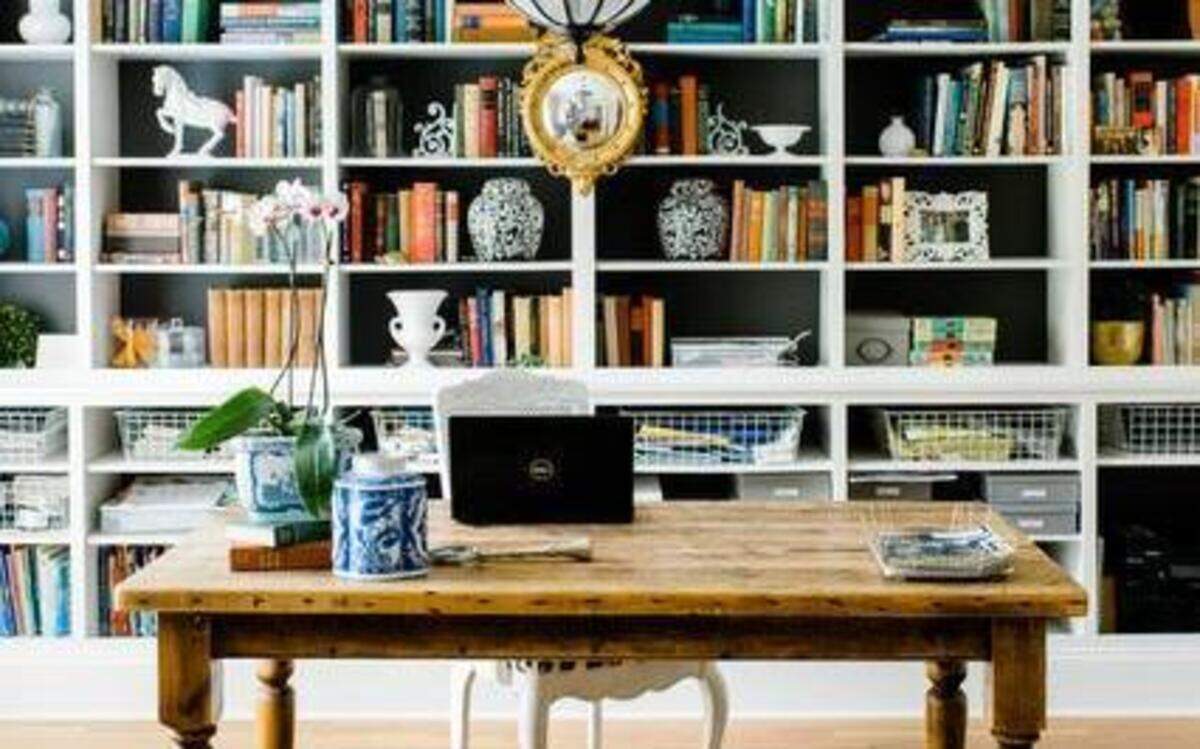 
Charlotte designer Emily Clark’s home office features a floor-to-ceiling library. 
