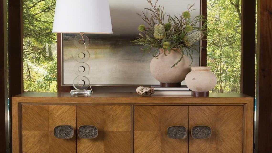 The Vienna sideboard from Global Views has a bleached walnut veneer and custom brass hardware.