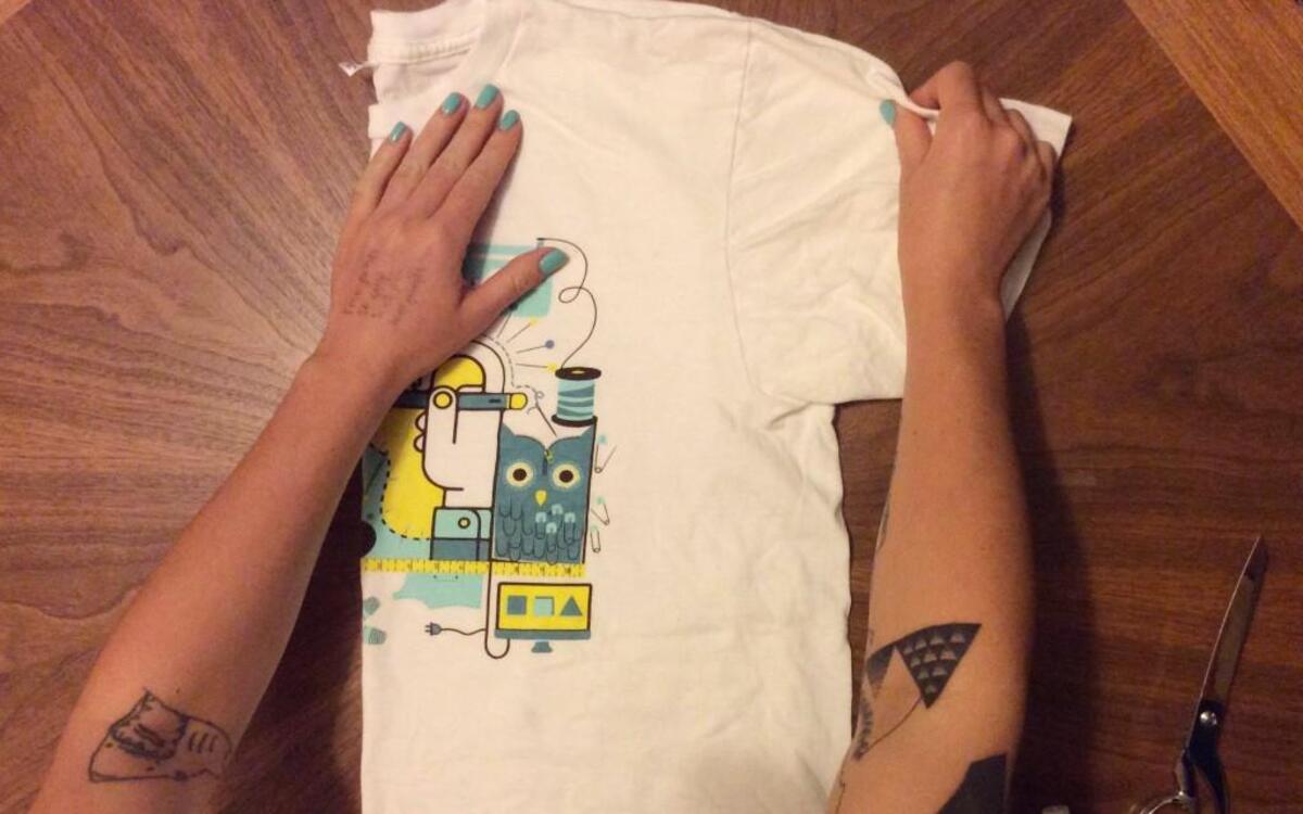 
River Takada-Capel of the recycled clothing business, RivTak, preps a t-shirt to repurpose into a tank top.
