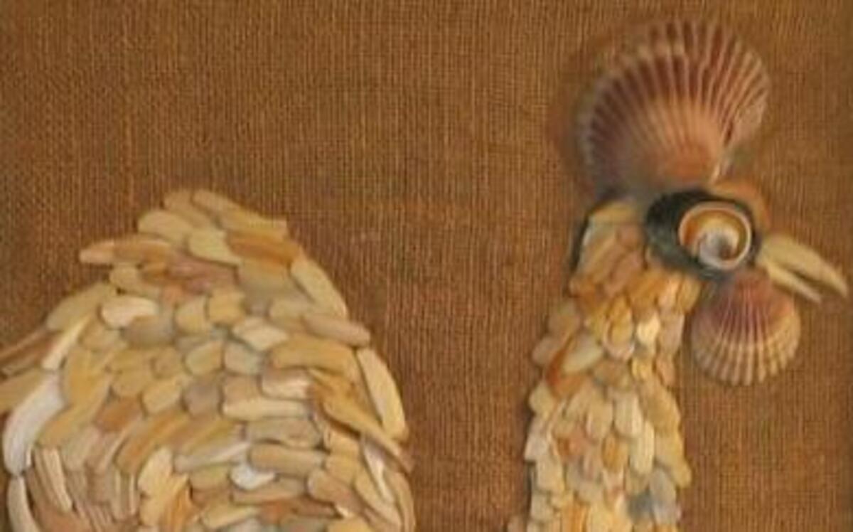 
Eva Hord of Garner cherishes this picture of a rooster made entirely of shells by her mother.
