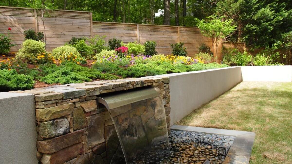 The simple, elegant water feature creates a mood of serenity in the Dwornik-Gervais garden in Chapel Hill.