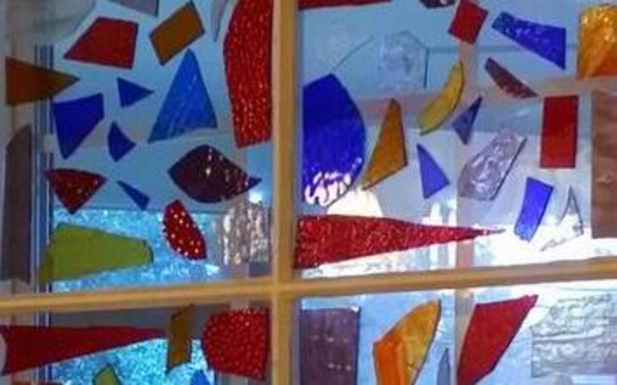 
An old farm window and box of broken stained glass pieces from the N.C. State Flea Market are Becca Smith’s prized possession.
