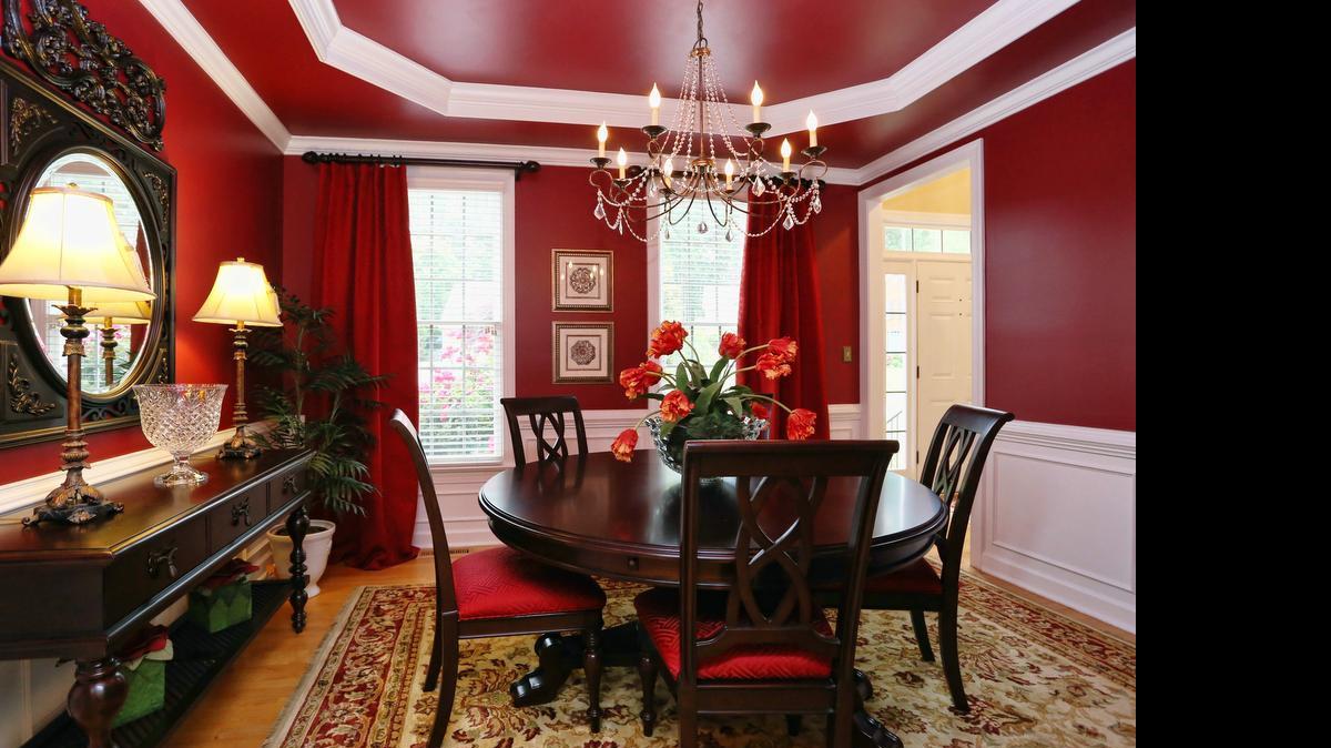 
Once painted, the traditional white wainscoting and trim work popped and architectural details of the tray ceiling reached new heights.
