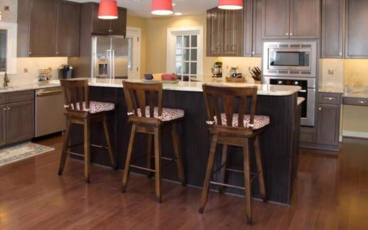 
Combining a dining room, living room and foyer created a multipurpose great room with a kitchen as its hub.

