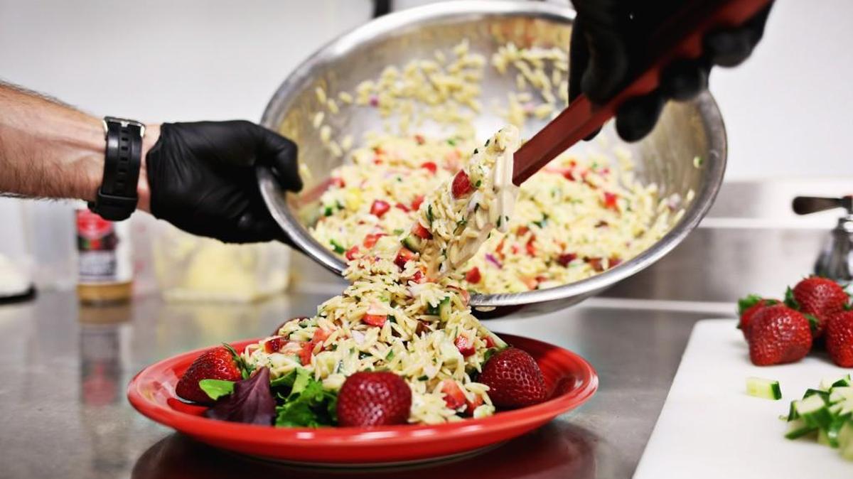 Adam Dillard of Berry Brothers makes his orzo pasta salad with the company's Strawberry Rosemary Vinaigrette May 11, 2018, in Raleigh. Dillard will be at the Got to Be NC event May 18-20th at the North Carolina State Fairgrounds.