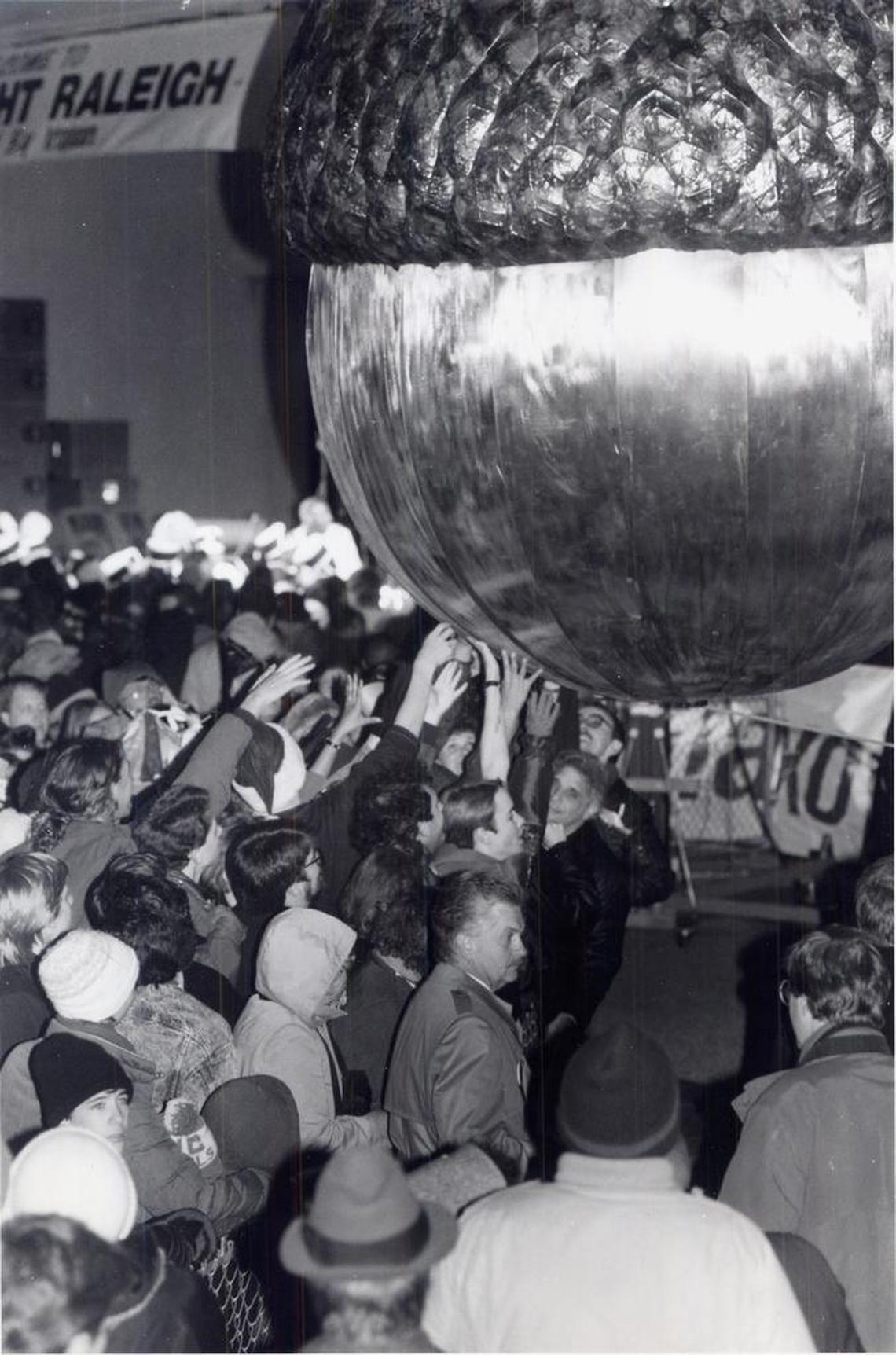 Crowds from Raleigh’s first “First Night” festivities greeted 1992 by touching the acorn for luck.