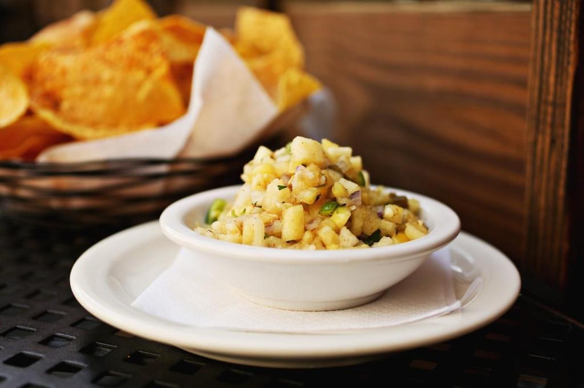 The sweet-spicy combination of diced pineapple, jalape–o and cilantro is supremely addictive with Salt & Lime Cabo's chipotle-dusted tortilla chips, but it's also very versatile.