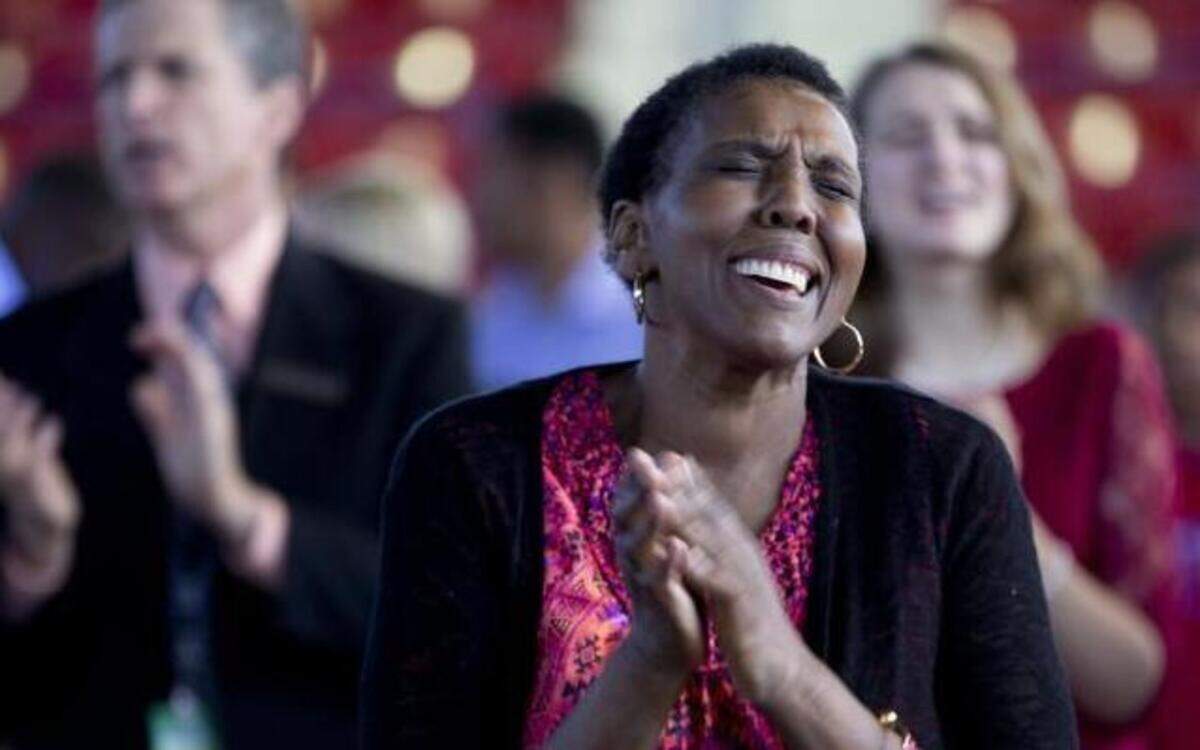 
Hermia McClean sings during Calvary Chapel of Cary’s Easter service inside Dorton Arena at the N.C. State Fairgrounds on Sunday.
