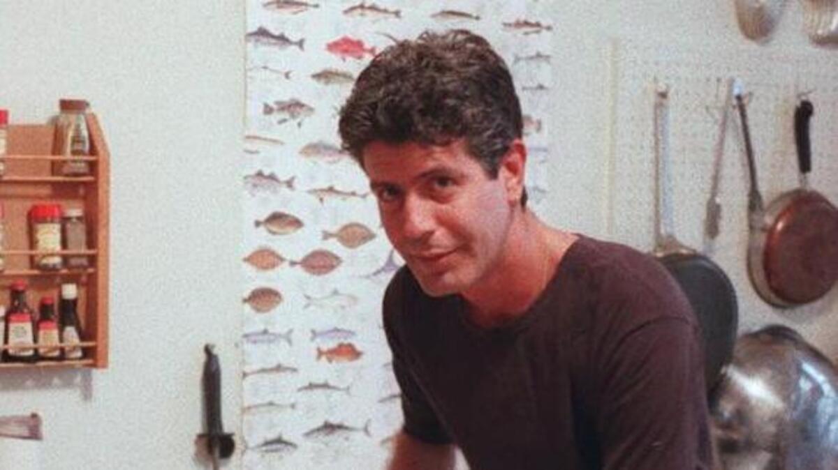 Anthony Bourdain prepared a meal in the kitchen of his New York apartment in 1997.